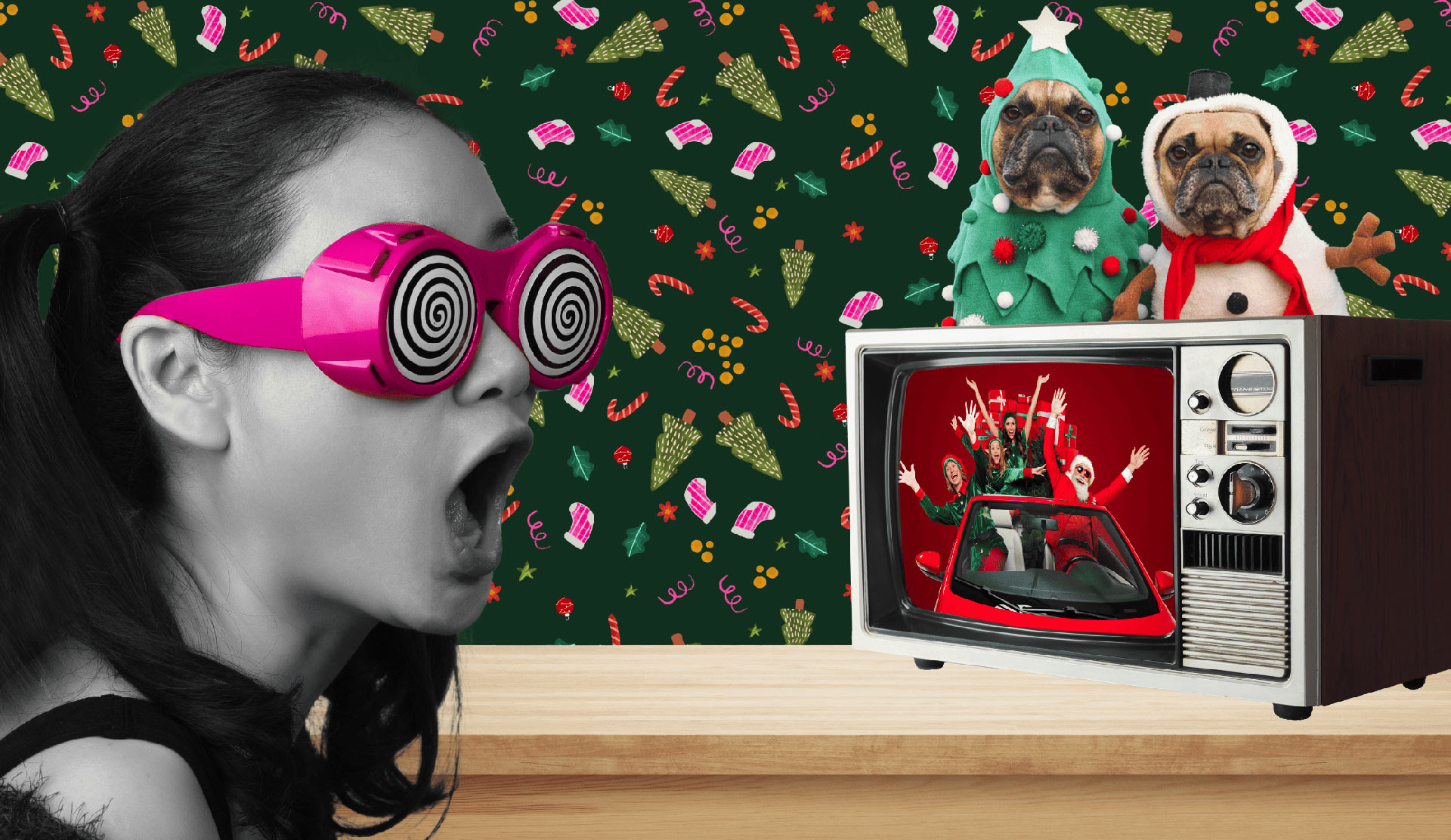An image of a young woman watching TV at Christmas while her dogs dressed in Christmas fancy dress look on.